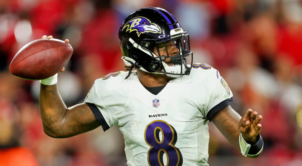 Baltimore Ravens quarterback Lamar Jackson throwing against Tampa Bay Buccaneers in 2022 game.