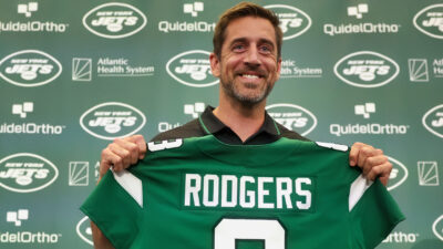 Aaron Rodgers holding jersey