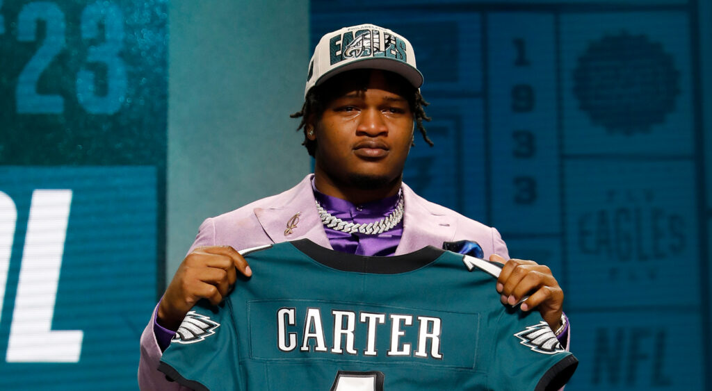 Jalen Carter holding up his Eagles jersey