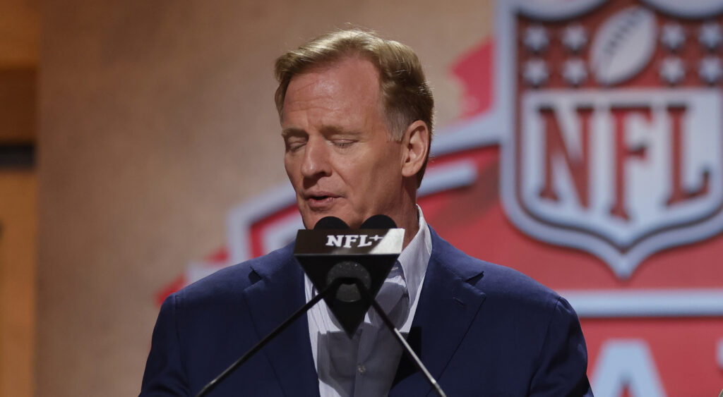 Roger Goodell speaking into a microphone