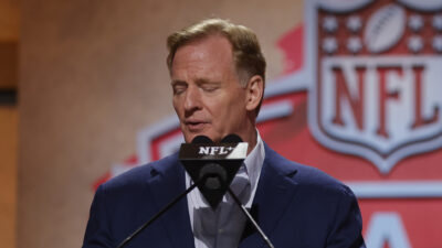 Roger Goodell speaking into a microphone