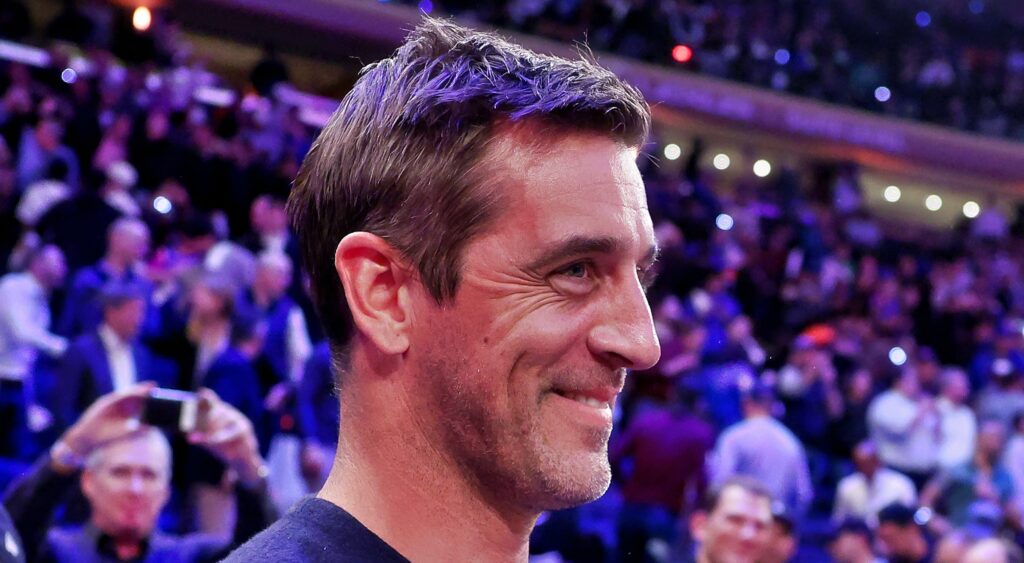 Aaron Rodgers looks on during a Knicks game.