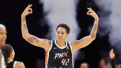 Brittney Griner with her hands in the air