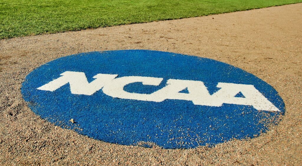The NCAA logo on the ground.