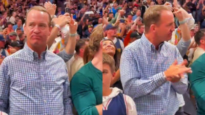 Photos of Peyton Manning reacting at NBA playoff game