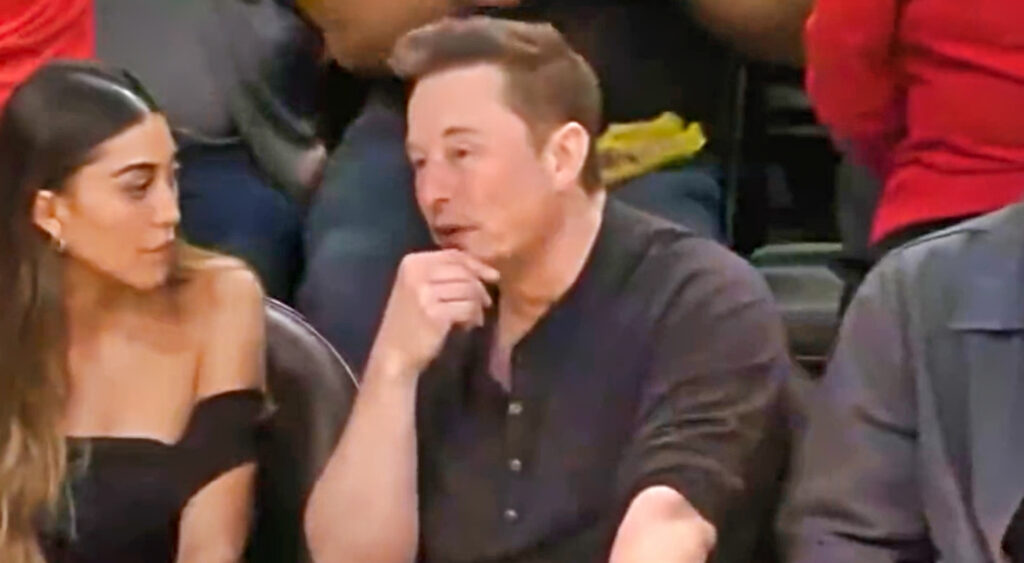 Tesla and Twitter CEO Elon Musk looking on during Lakers-Warriors playoff game.