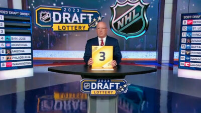 Presenter holding up the No. 3 at the NHL Draft Lottery