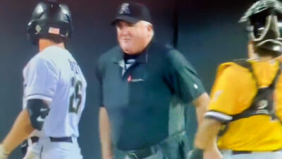 Umpire and two baseball players