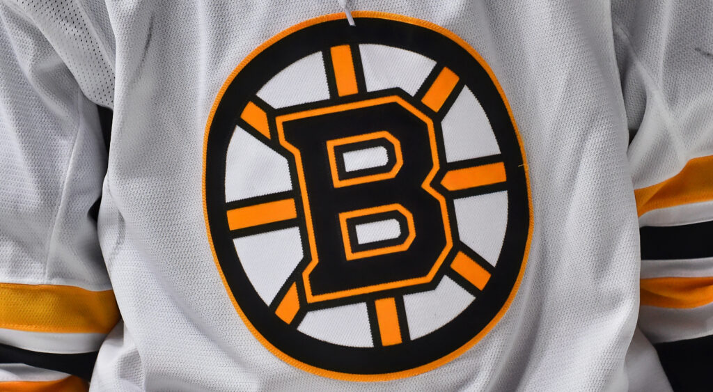 Boston Bruins logo on jersey.