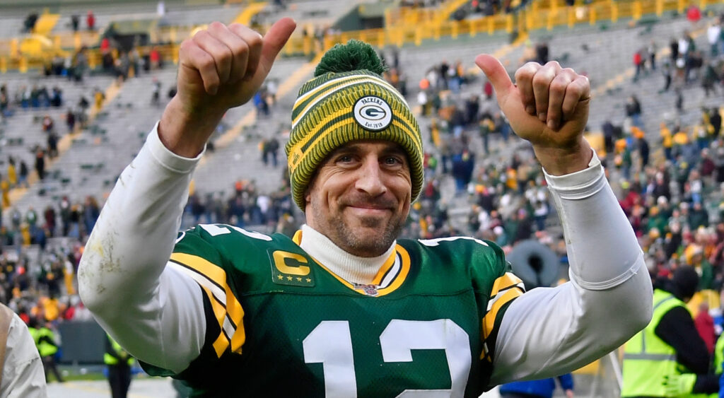 Aaron Rodgers smiling in packers uniform.