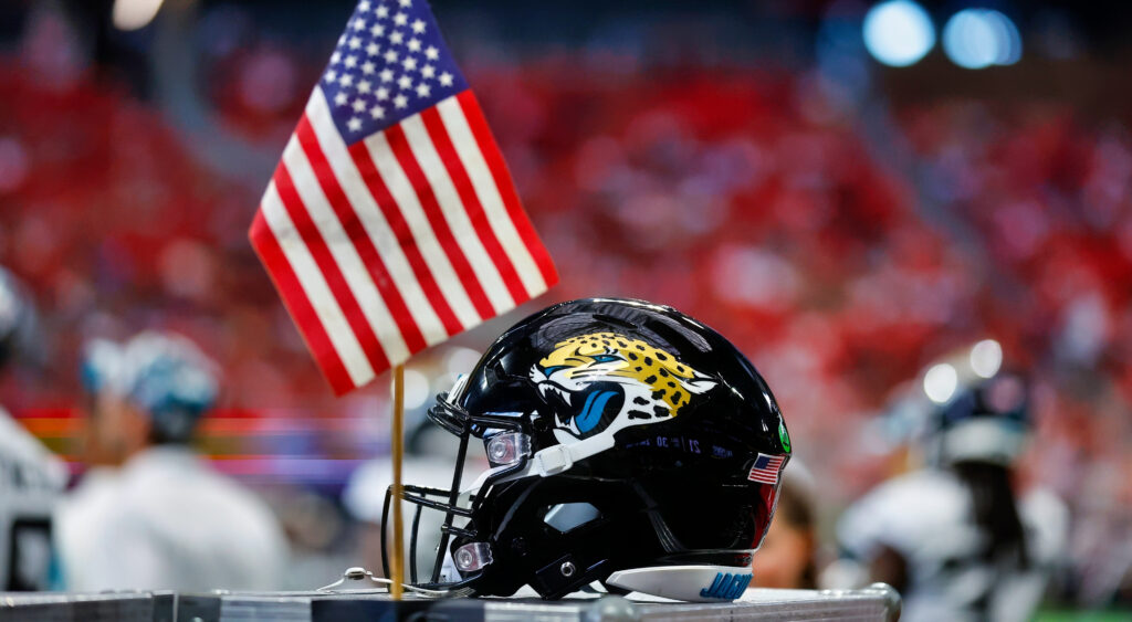 Jaguars helmet next to American flag
