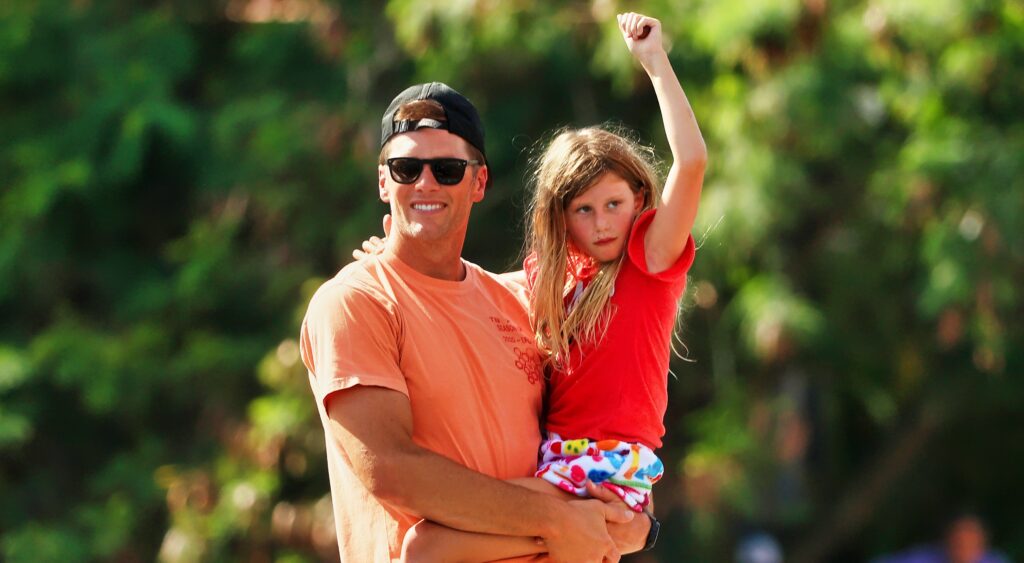 Tom Brady and his daughter Vivian celebrate during the Buccaneers' Super Bowl parade.