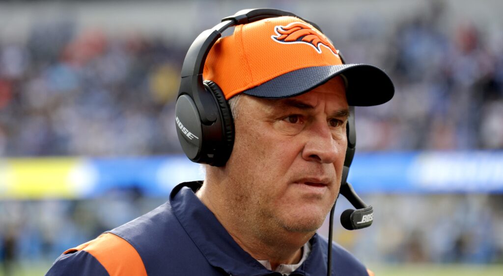 Vic Fangio with headset on and Broncos gear