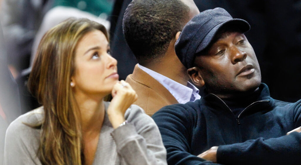 Michael Jordan sitting next to his wife Yvette Prieto