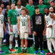 Boston Celtics players on the sideline