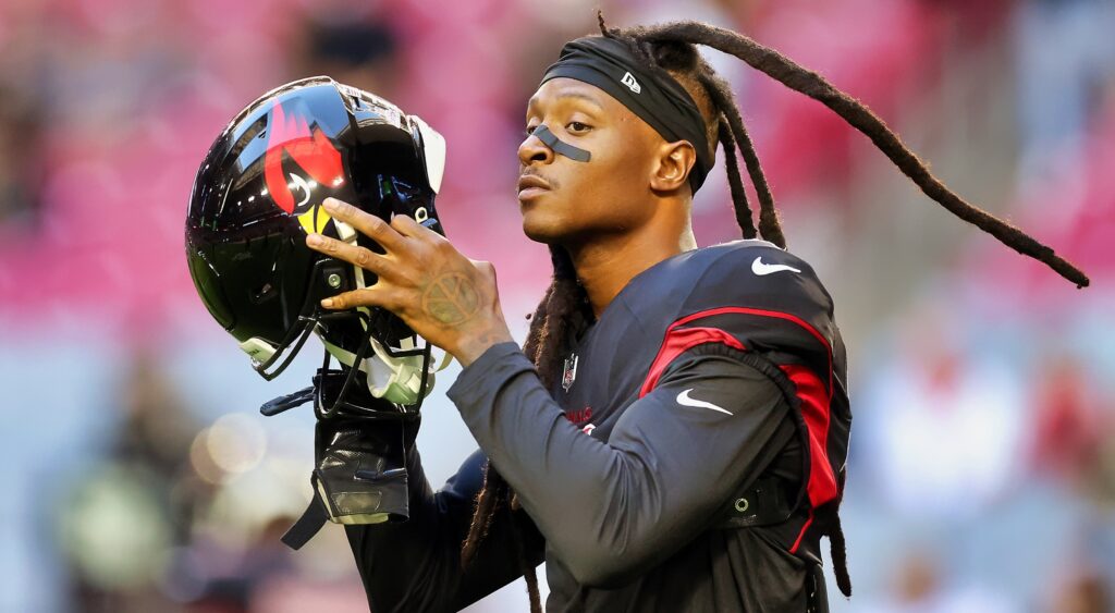 DeAndre Hopkins holding Cardinals helmet