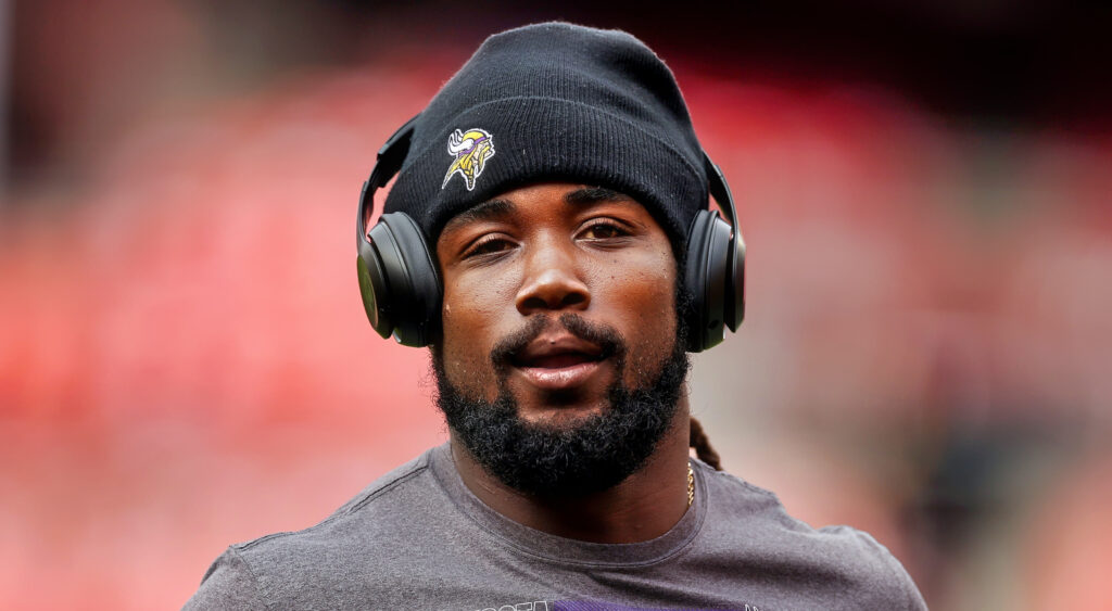 Dalvin Cook listening to music on field.