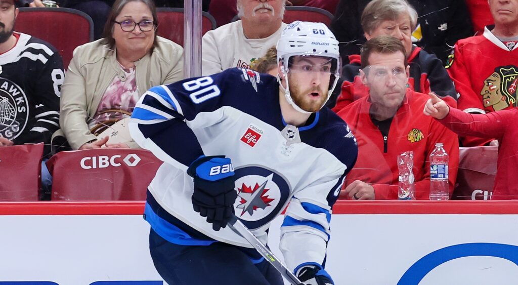 Pierre Luc-Dubois of Winnipeg Jets skating with puck.