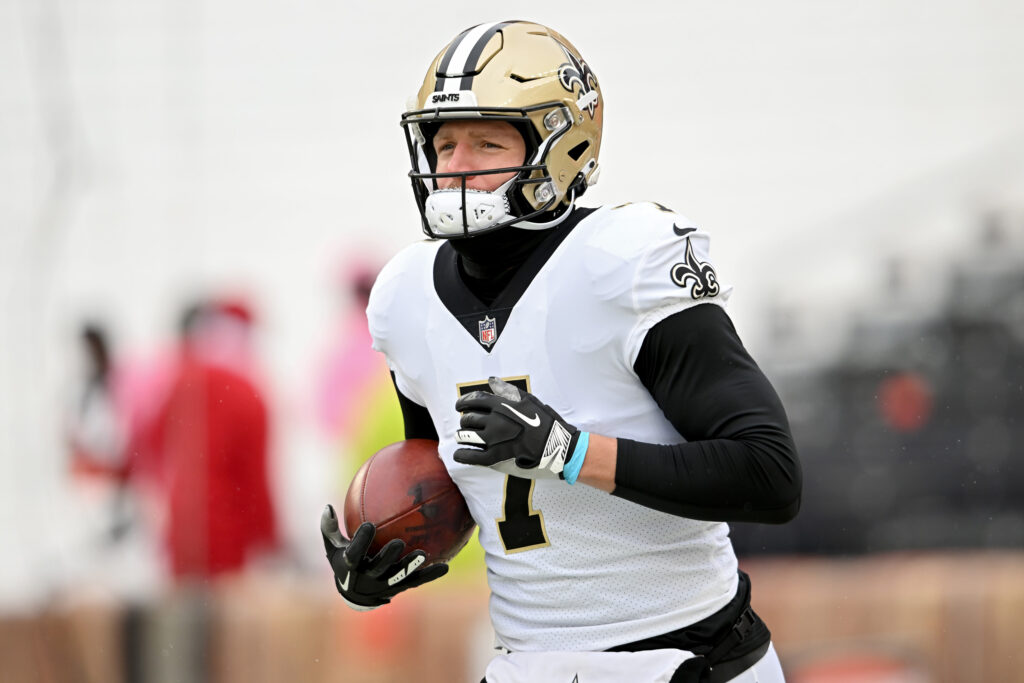 Taysom Hill of New Orleans Saints running with football.
