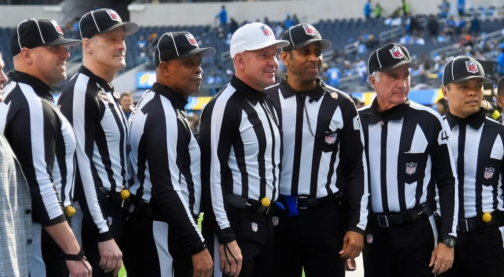 NFL referees posing for a photo at SoFi Stadium.