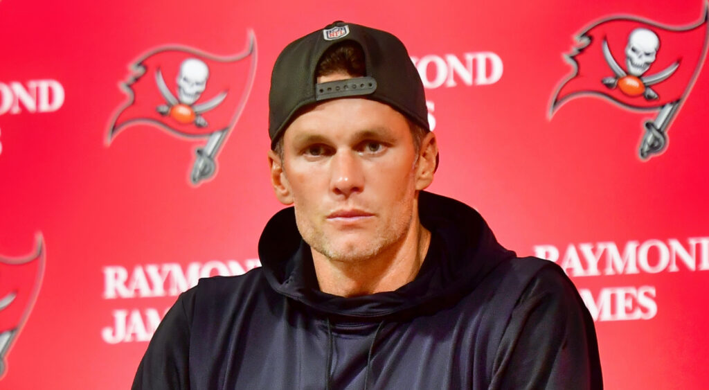TAMPA, FLORIDA - JANUARY 16: Tom Brady #12 of the Tampa Bay Buccaneers speaks to the media after losing to the Dallas Cowboys 31-14 in the NFC Wild Card playoff game at Raymond James Stadium on January 16, 2023 in Tampa, Florida. (Photo by Julio Aguilar/Getty Images)
