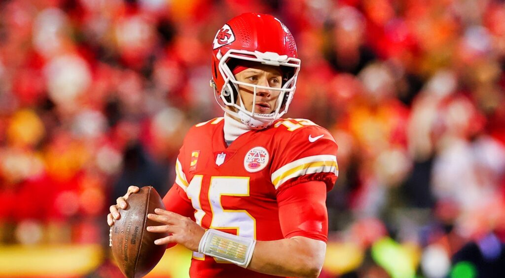 Patrick Mahomes looking to throw ball during game.