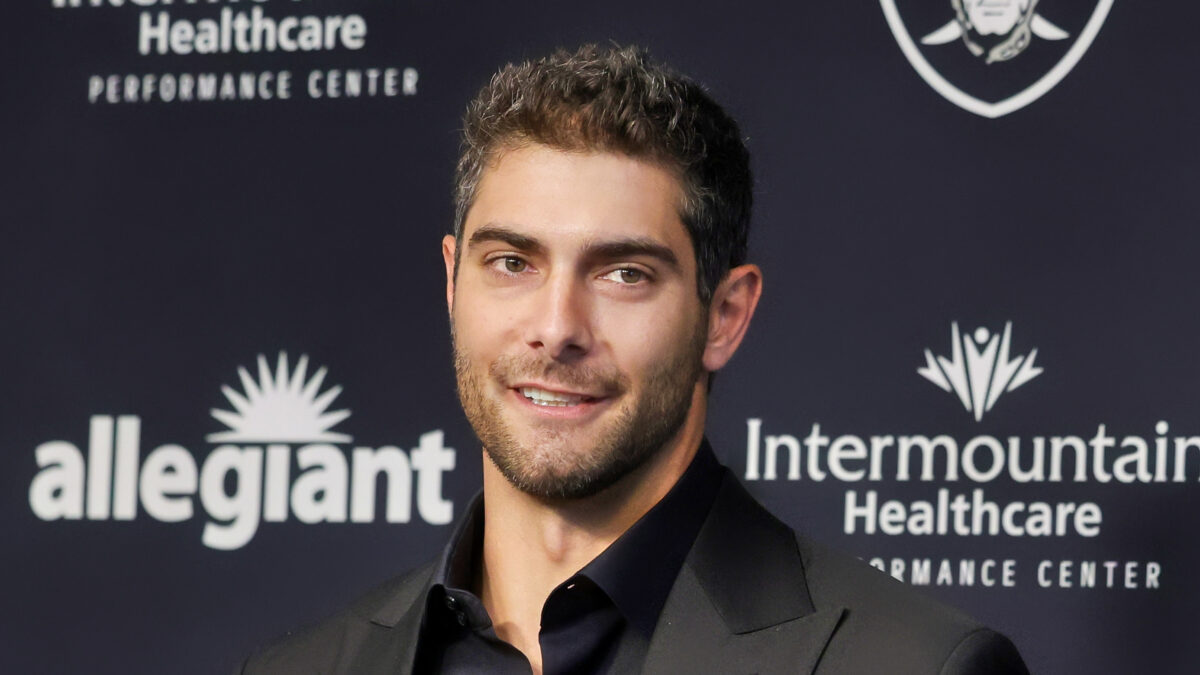 Jimmy G smiling in black suit