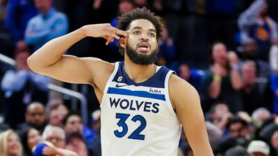 Karl-Anthony Towns pointing to his head