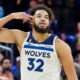 Karl-Anthony Towns pointing to his head