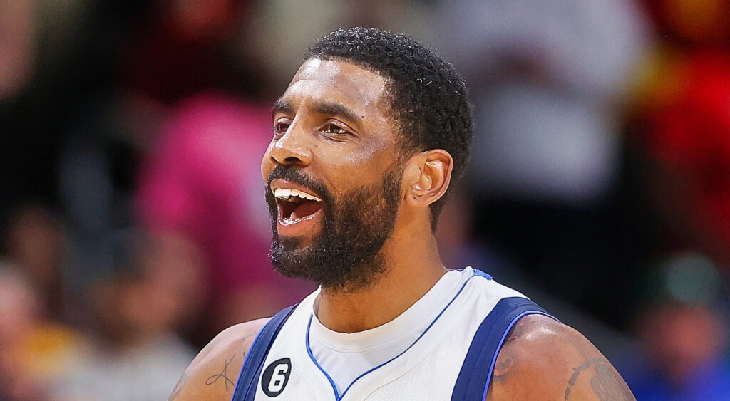 Dallas Mavericks' point guard Kyrie Irving reacts after taking a foul.
