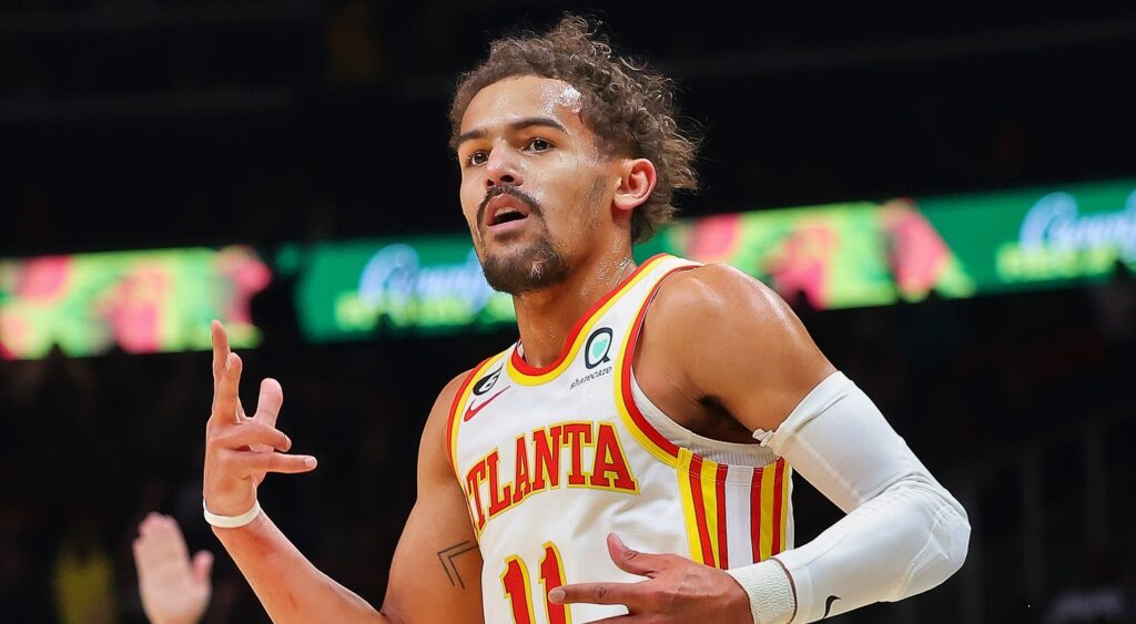 Trae Young reacts to hitting a three-pointer.