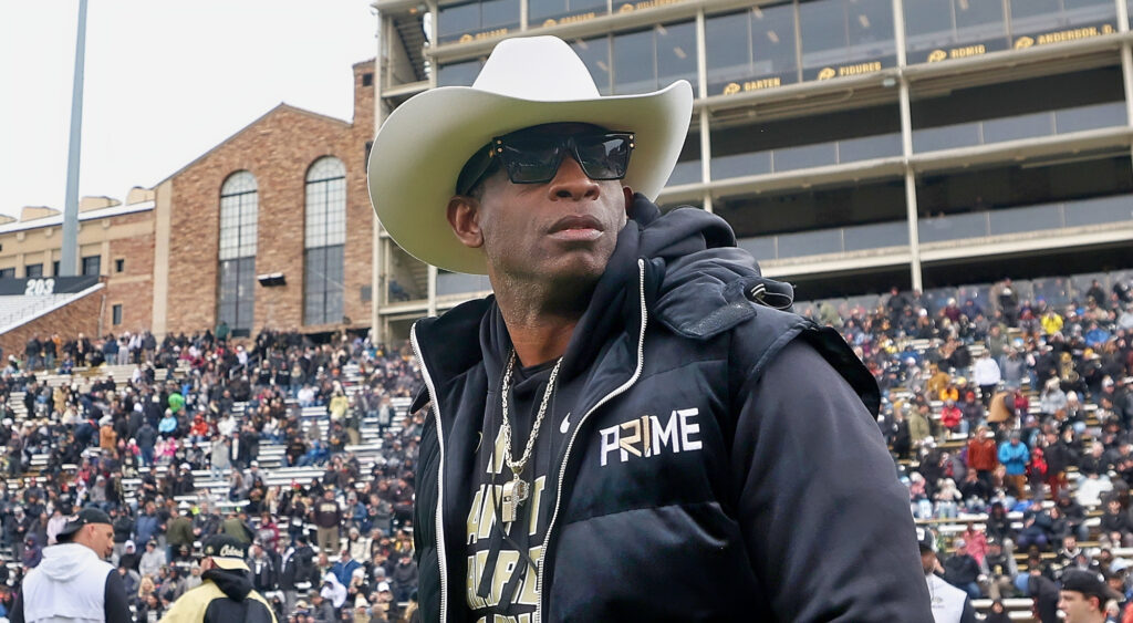 Deion Sanders wearing cowboy hat and shades