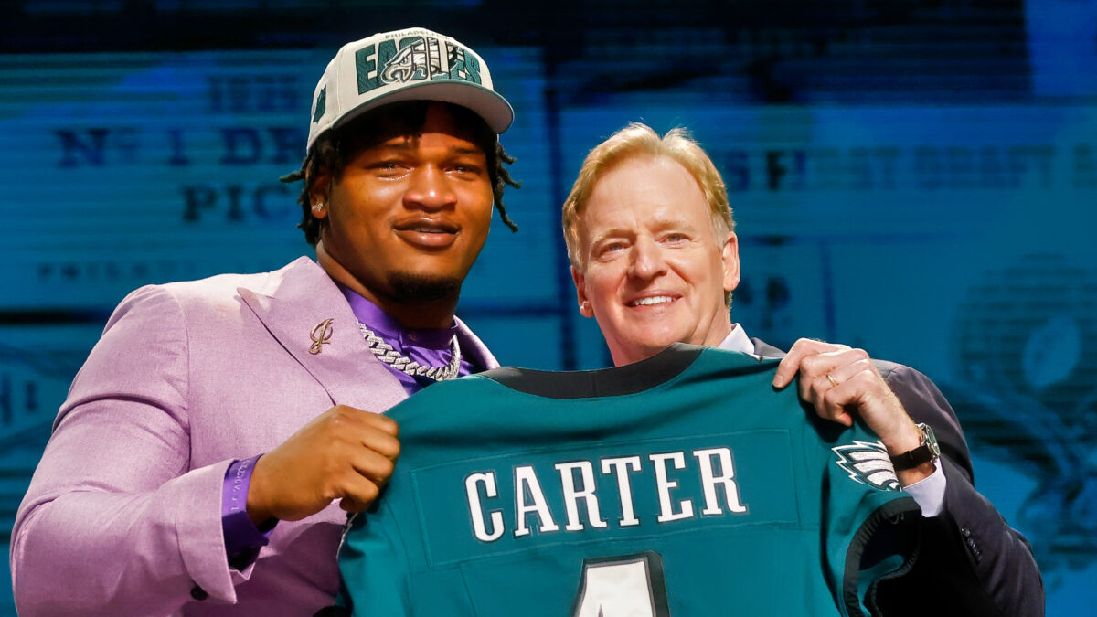Jalen carter holding jersey with Roger Goodell