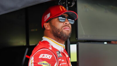 Bubba Wallace in cap and shades