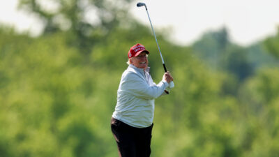 Donald Trump holding a golf club