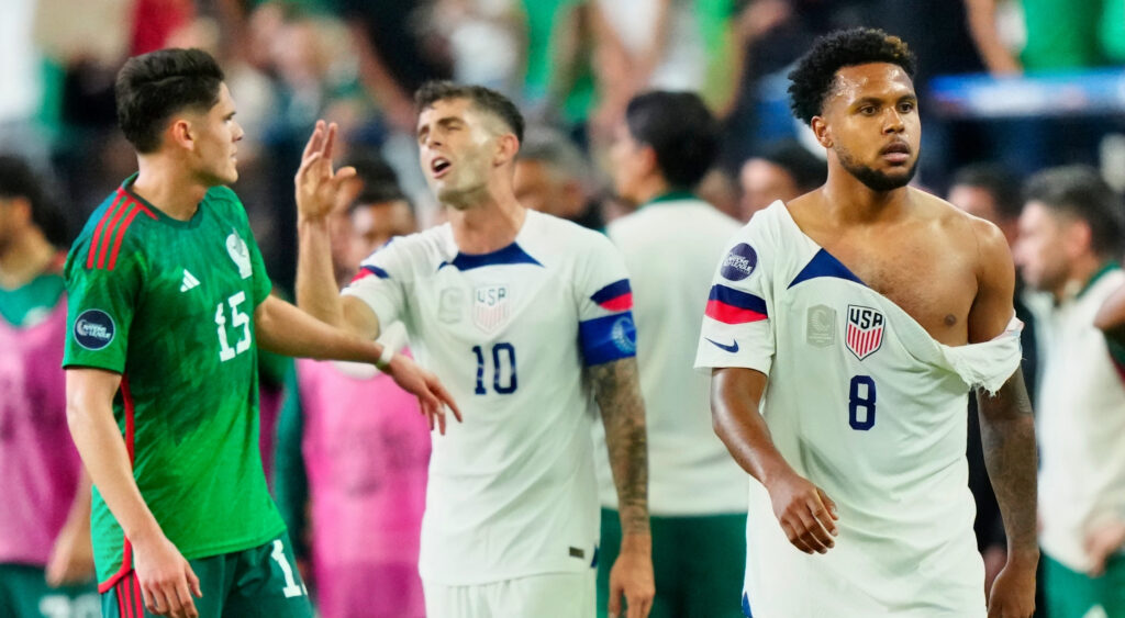 Weston Mckennie walkign off with a torn jersey during match between USA and Mexico
