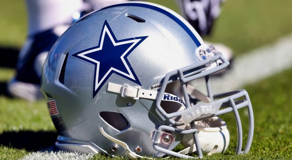 A Dallas Cowboys helmet on the field.