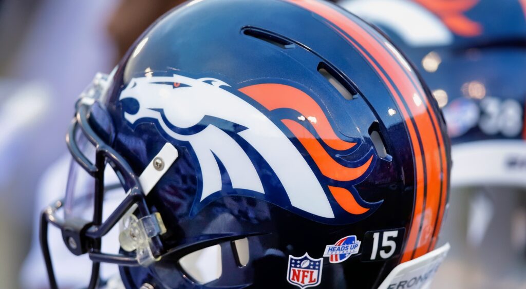 A Denver Broncos helmet on the bench.