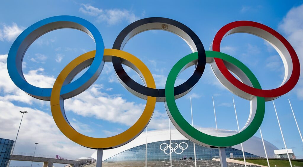 The Olympic rings in front of an arena at the Winter Olympics in 2014.