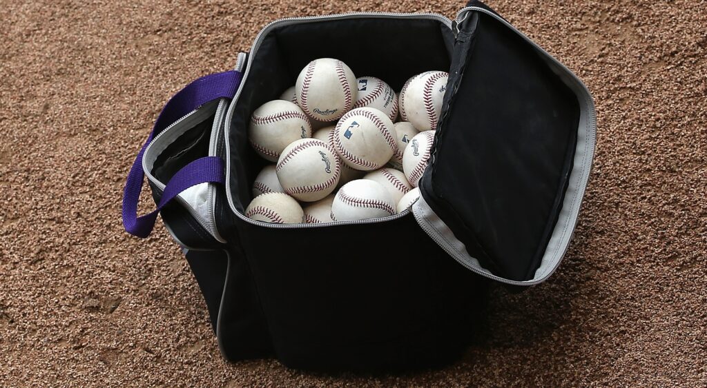 Bag of baseballs shown on pitcher's mound.
