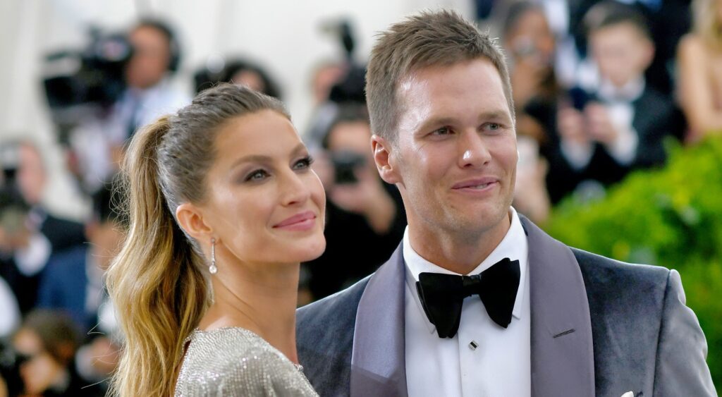 Tom Brady and Gisele pose together on the red carpet.