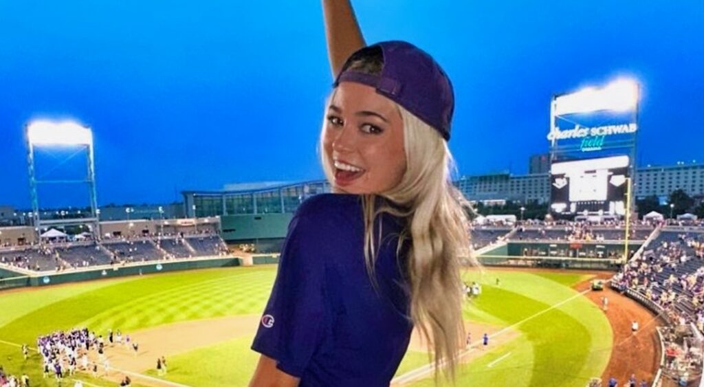 Olivia Dunne poses for a photo at the College World Series.