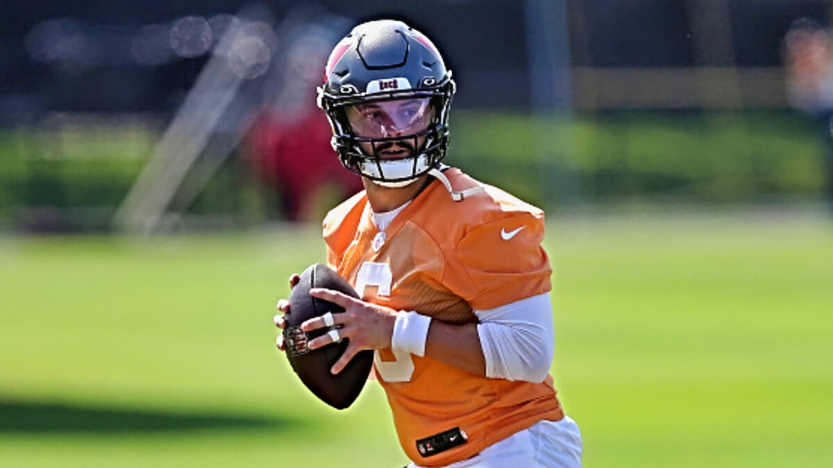 Baker Mayfield with a football in practice