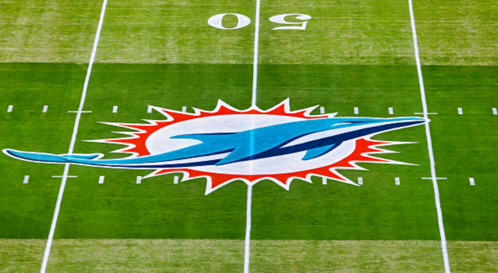 Miami Dolphins logo on field.