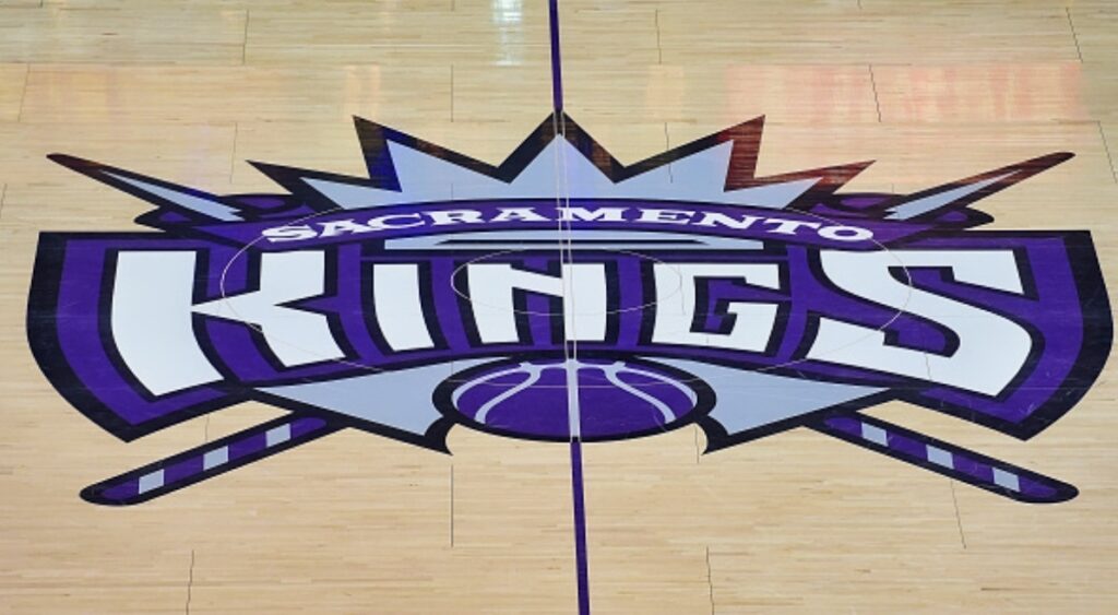 The Sacramento Kings logo on the court.