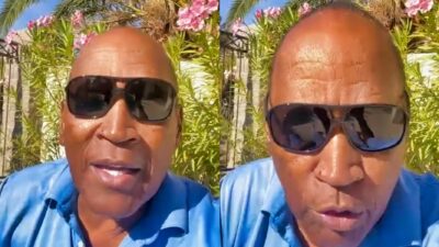 OJ Simpson in glasses speaking to camera.