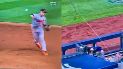 Photos showing cameraman getting hit in the face by overthrow from Orioles player