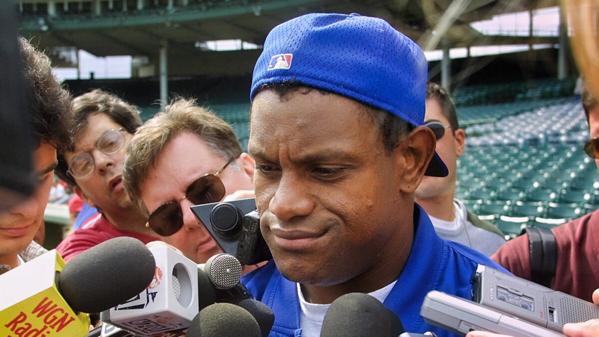 Sammy Sosa surrounded by mics and reporters