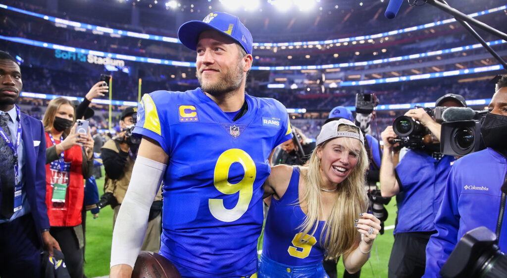 Matthew Stafford holding his wife Kelly