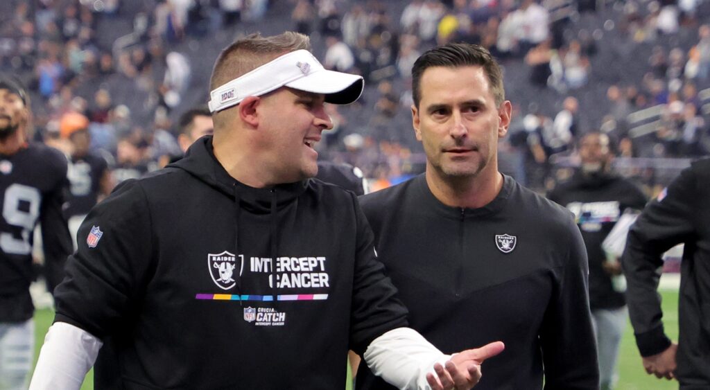 Las Vegas Raiders' head coach (left) speaking to GM Dave Ziegler (right).